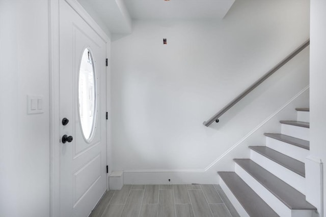 161 Sumner St Unit 1, Quincy, MA 02169 - entryway featuring stairway, baseboards, and wood tiled floors