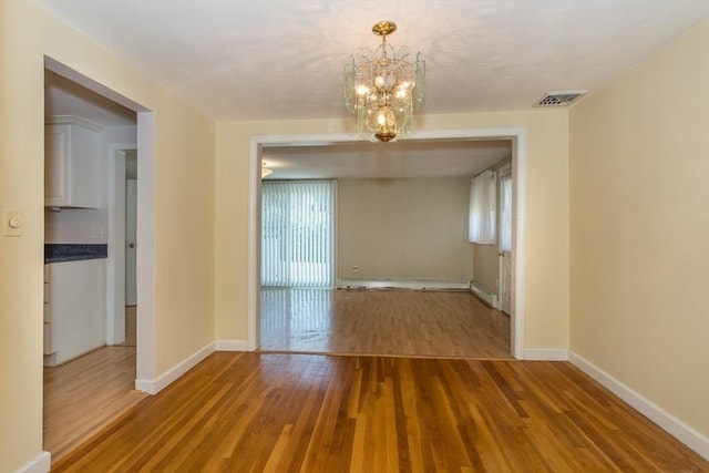 69 Gerald Rd, Milton, MA 02186 - unfurnished dining area with a chandelier and wood finished floors