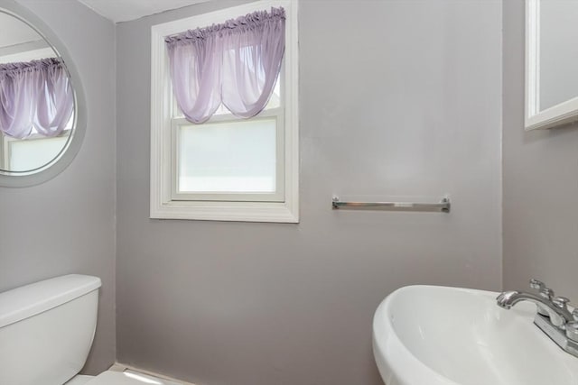 69 Gerald Rd, Milton, MA 02186 - half bathroom featuring a sink and toilet