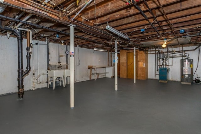 69 Gerald Rd, Milton, MA 02186 - unfinished basement with gas water heater and a heating unit