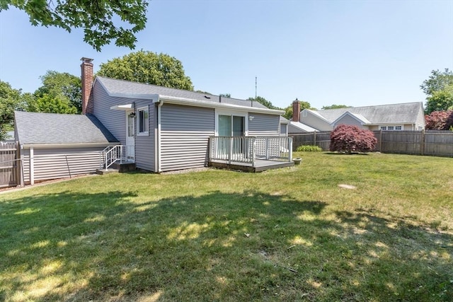 69 Gerald Rd, Milton, MA 02186 - back of house featuring a fenced backyard, a chimney, and a wooden deck