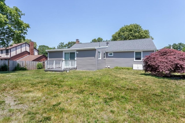 69 Gerald Rd, Milton, MA 02186 - back of house with a chimney and a wooden deck