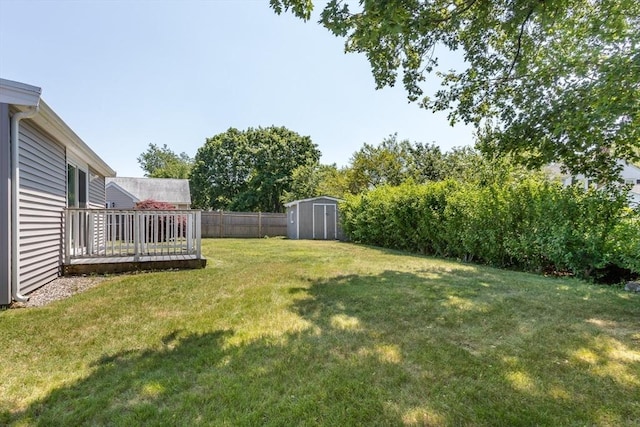 69 Gerald Rd, Milton, MA 02186 - fenced backyard featuring a storage unit