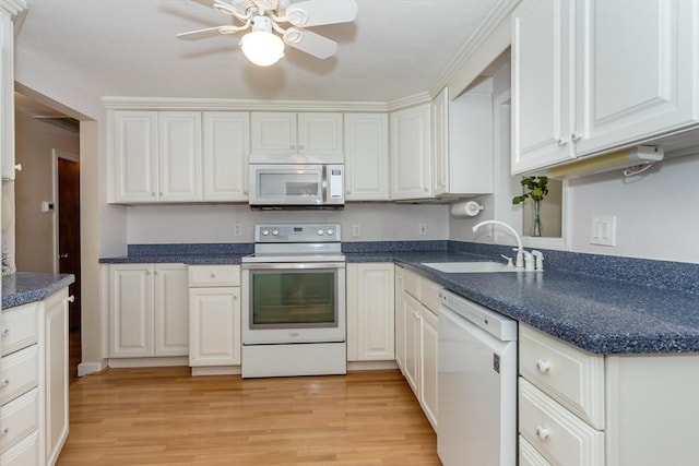 69 Gerald Rd, Milton, MA 02186 - kitchen featuring white appliances, a ceiling fan, light wood-type flooring, and white cabinetry