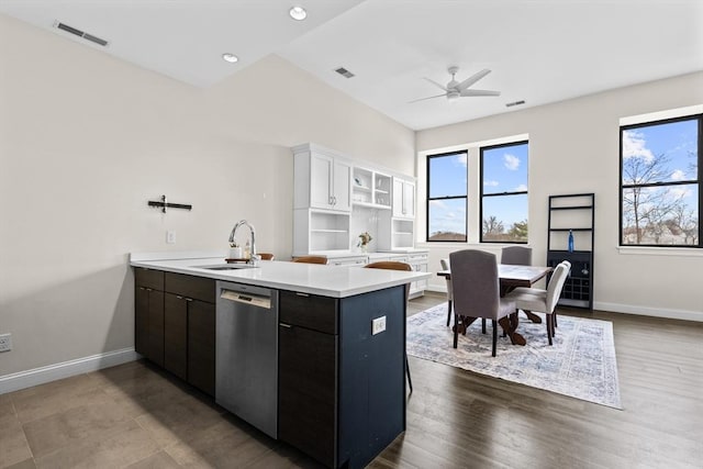 kitchen with white cabinets, dishwasher, sink, kitchen peninsula, and dark brown cabinets