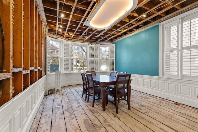 dining area with wood-type flooring