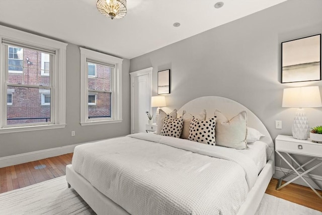 bedroom with hardwood / wood-style floors