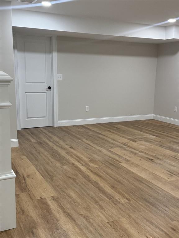 basement featuring wood-type flooring