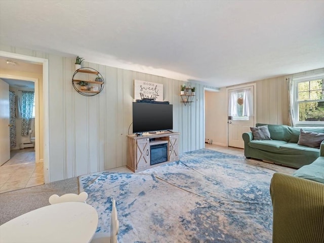 12 Allen St, Pembroke, MA 02359 - tiled living area featuring a baseboard heating unit and a glass covered fireplace