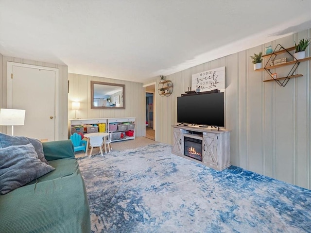 12 Allen St, Pembroke, MA 02359 - carpeted living area featuring a glass covered fireplace