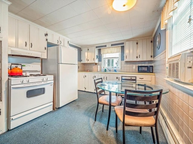 12 Allen St, Pembroke, MA 02359 - kitchen featuring white appliances, under cabinet range hood, dark carpet, light countertops, and cooling unit