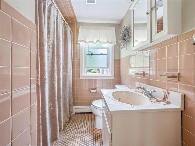 12 Allen St, Pembroke, MA 02359 - bathroom with tile walls, baseboard heating, and vanity