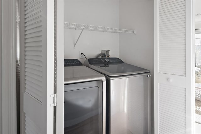 laundry room featuring laundry area and washing machine and dryer
