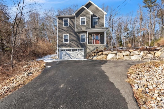 view of front of house with a garage and aphalt driveway