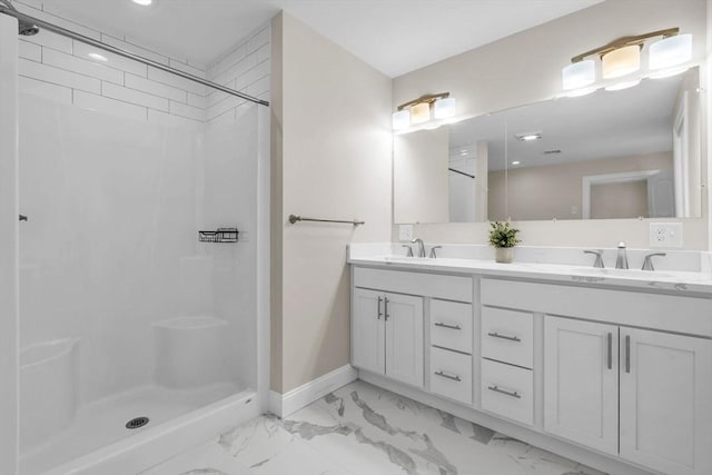 full bath featuring marble finish floor, double vanity, a stall shower, and a sink