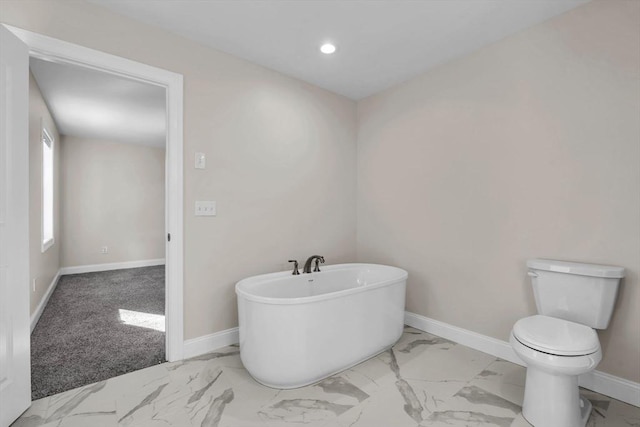 full bath with toilet, recessed lighting, baseboards, marble finish floor, and a soaking tub