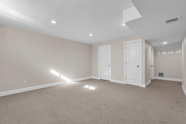 interior space featuring recessed lighting, visible vents, and baseboards