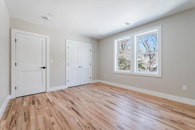 unfurnished bedroom with light hardwood / wood-style flooring