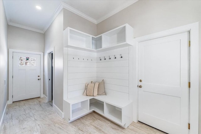 mudroom featuring crown molding