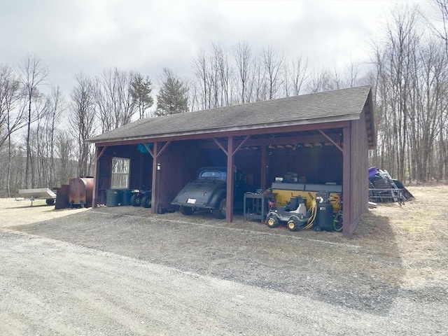 view of parking / parking lot with a carport