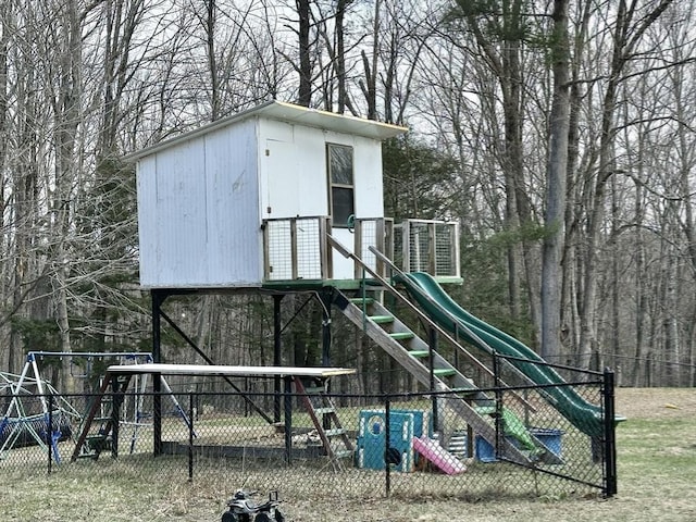 view of jungle gym featuring fence