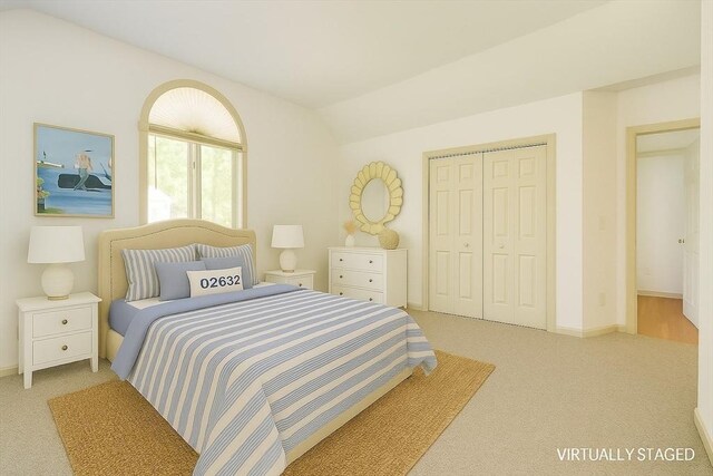 9 Dacey Dr, Barnstable, MA 02632 - bedroom with light carpet, a closet, and vaulted ceiling