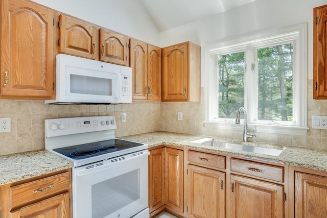 9 Dacey Dr, Barnstable, MA 02632 - kitchen with white appliances, lofted ceiling, backsplash, and light stone countertops