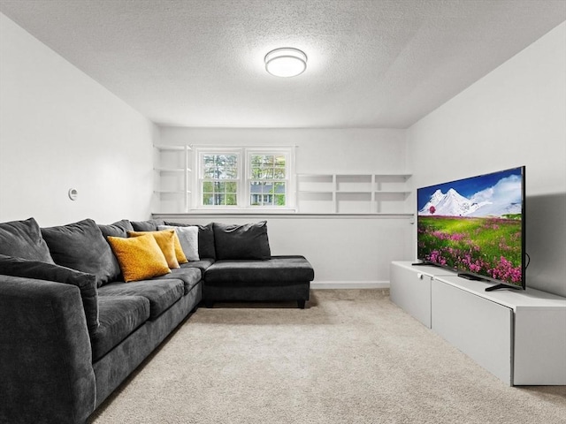 living area with light colored carpet and a textured ceiling