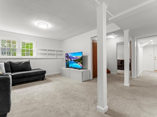living room featuring carpet floors, baseboards, a textured ceiling, and stairway