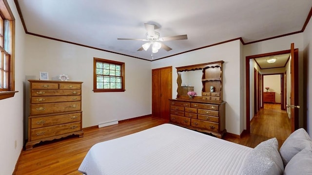 40 Revere St, Gloucester, MA 01930 - bedroom with wood finished floors, crown molding, a baseboard heating unit, and ceiling fan
