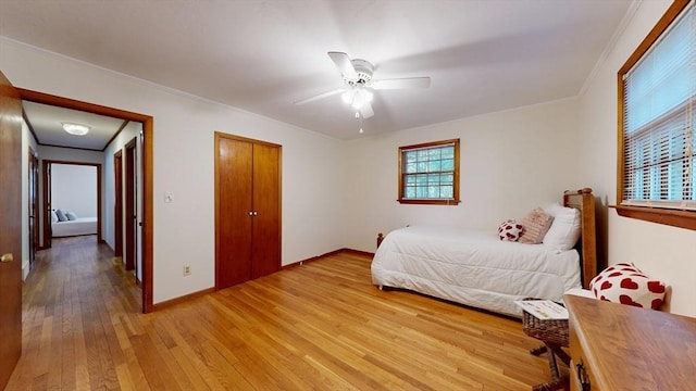 40 Revere St, Gloucester, MA 01930 - bedroom featuring light wood-type flooring, ornamental molding, ceiling fan, and a closet
