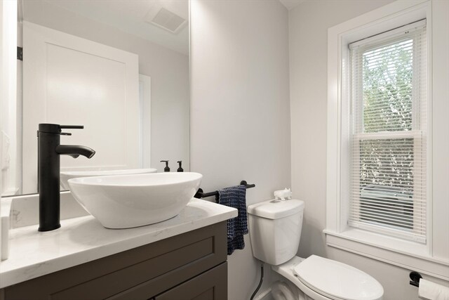 bathroom with vanity and toilet