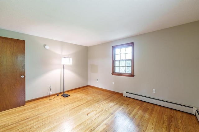53 Greenleaf Dr, Hampden, MA 01036 - empty room featuring light wood-style floors, a baseboard radiator, and baseboards