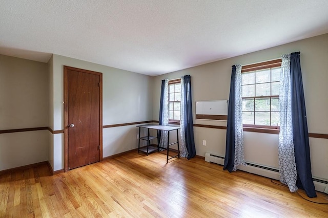 53 Greenleaf Dr, Hampden, MA 01036 - spare room featuring light wood finished floors, a baseboard heating unit, and baseboards
