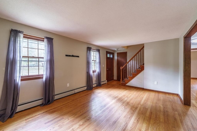 53 Greenleaf Dr, Hampden, MA 01036 - entryway with light wood finished floors, stairway, baseboards, and a textured ceiling