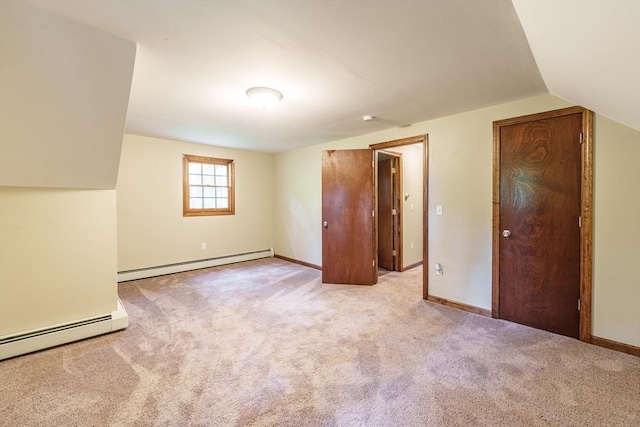 53 Greenleaf Dr, Hampden, MA 01036 - unfurnished bedroom featuring baseboard heating, light colored carpet, vaulted ceiling, and baseboards