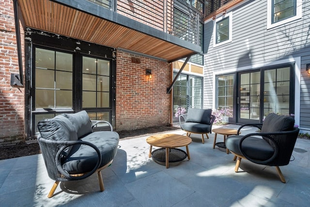 view of patio / terrace featuring a balcony and an outdoor living space