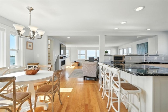 119 Fort Point Rd, Weymouth, MA 02191 - dining room featuring light wood-style flooring, recessed lighting, and a chandelier