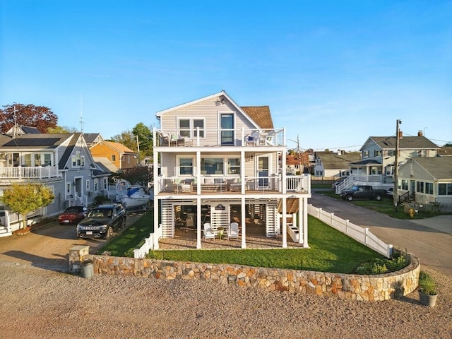 119 Fort Point Rd, Weymouth, MA 02191 - rear view of house featuring stairway, a balcony, and a residential view