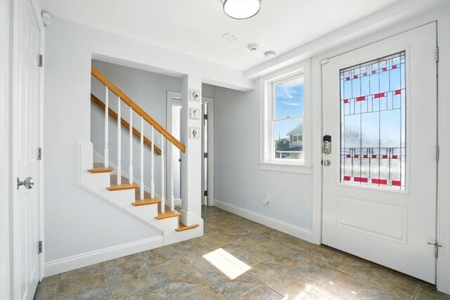 119 Fort Point Rd, Weymouth, MA 02191 - foyer entrance with stairs, baseboards, and stone finish flooring