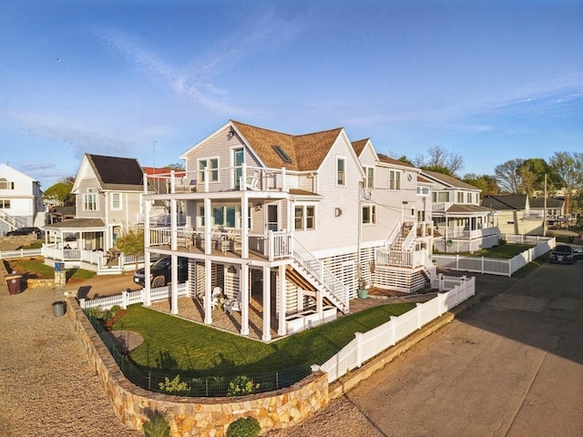 119 Fort Point Rd, Weymouth, MA 02191 - rear view of property with a fenced backyard, a residential view, and a balcony