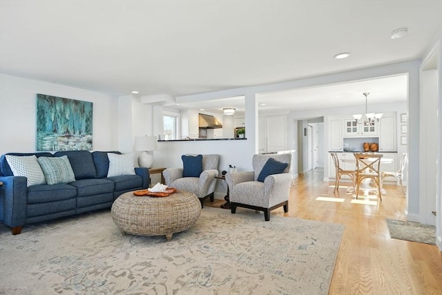 119 Fort Point Rd, Weymouth, MA 02191 - living room with light wood-type flooring, a chandelier, and recessed lighting