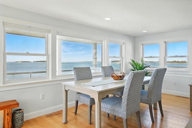 119 Fort Point Rd, Weymouth, MA 02191 - dining area with light wood-style floors, baseboards, a water view, and recessed lighting