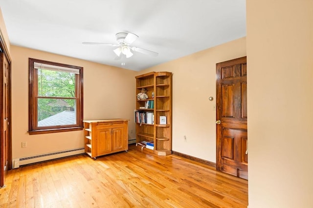 906 Clark St, Gardner, MA 01440 - unfurnished room with baseboard heating, light wood-type flooring, and a ceiling fan