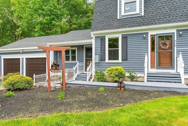 906 Clark St, Gardner, MA 01440 - view of front of house with a shingled roof, a garage, and a porch