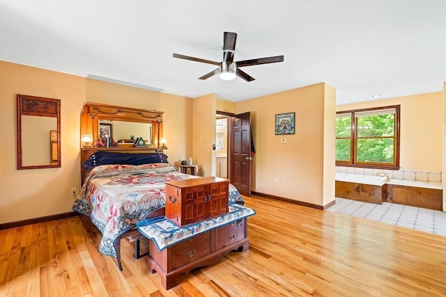 906 Clark St, Gardner, MA 01440 - bedroom with light wood-type flooring, ensuite bathroom, baseboards, and a ceiling fan