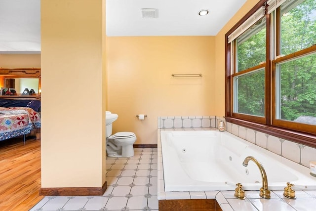 906 Clark St, Gardner, MA 01440 - full bathroom featuring a jetted tub, baseboards, toilet, and ensuite bath