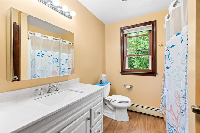 906 Clark St, Gardner, MA 01440 - full bath featuring a baseboard radiator, vanity, wood finished floors, toilet, and curtained shower
