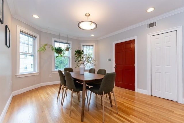 68 Line St Unit 2, Somerville, MA 02143 - dining area with light wood-type flooring, crown molding, and recessed lighting