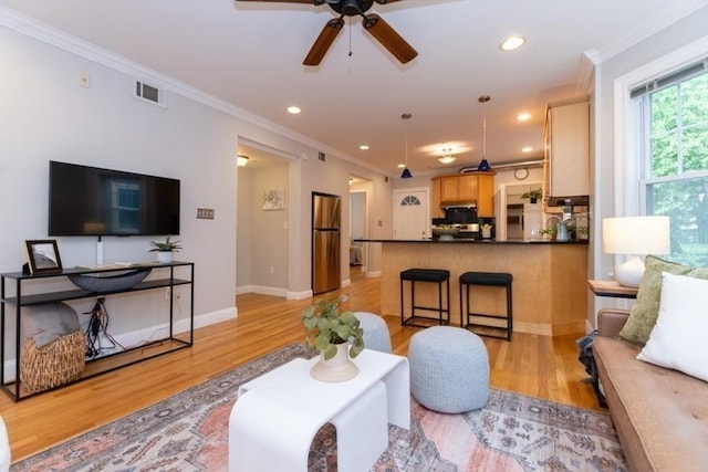 68 Line St Unit 2, Somerville, MA 02143 - living area featuring ceiling fan, light wood finished floors, recessed lighting, and crown molding